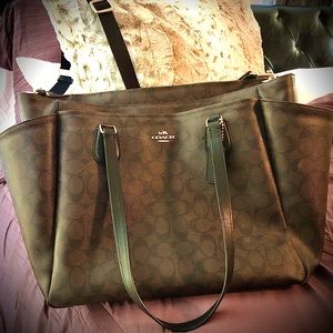 Coach briefcase with shoulder straps and cross body.